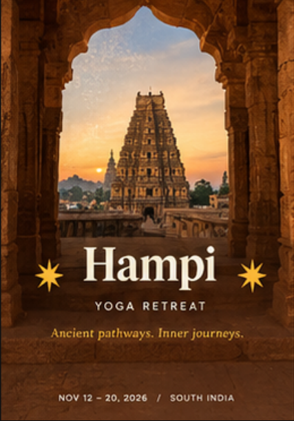 Temple gopuram framed by a stone arch at sunset, Ananda Yoga Life retreat visual
